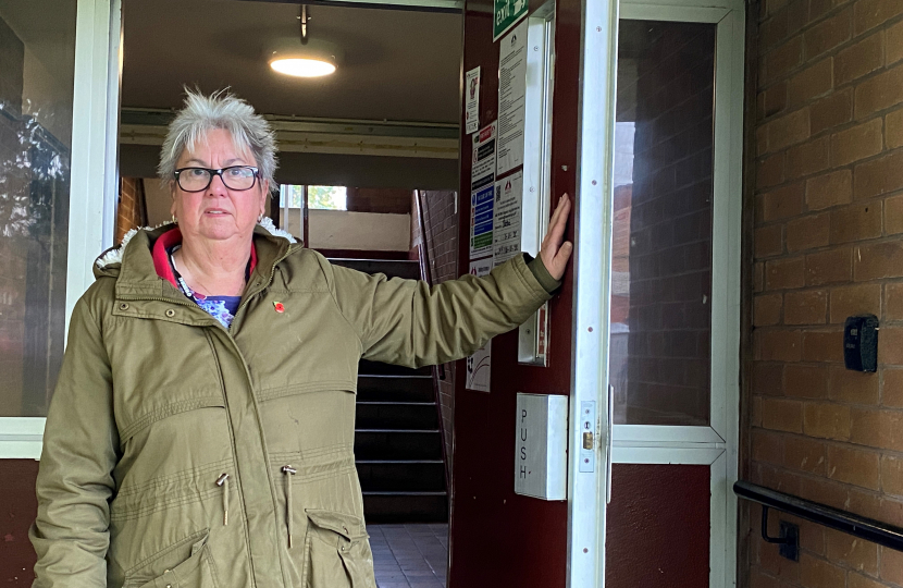 Cllr. Vida Wilson at the entrance to one of the blocks